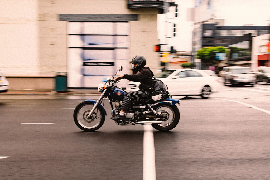 man riding motorcycle practicing motorcycle safety