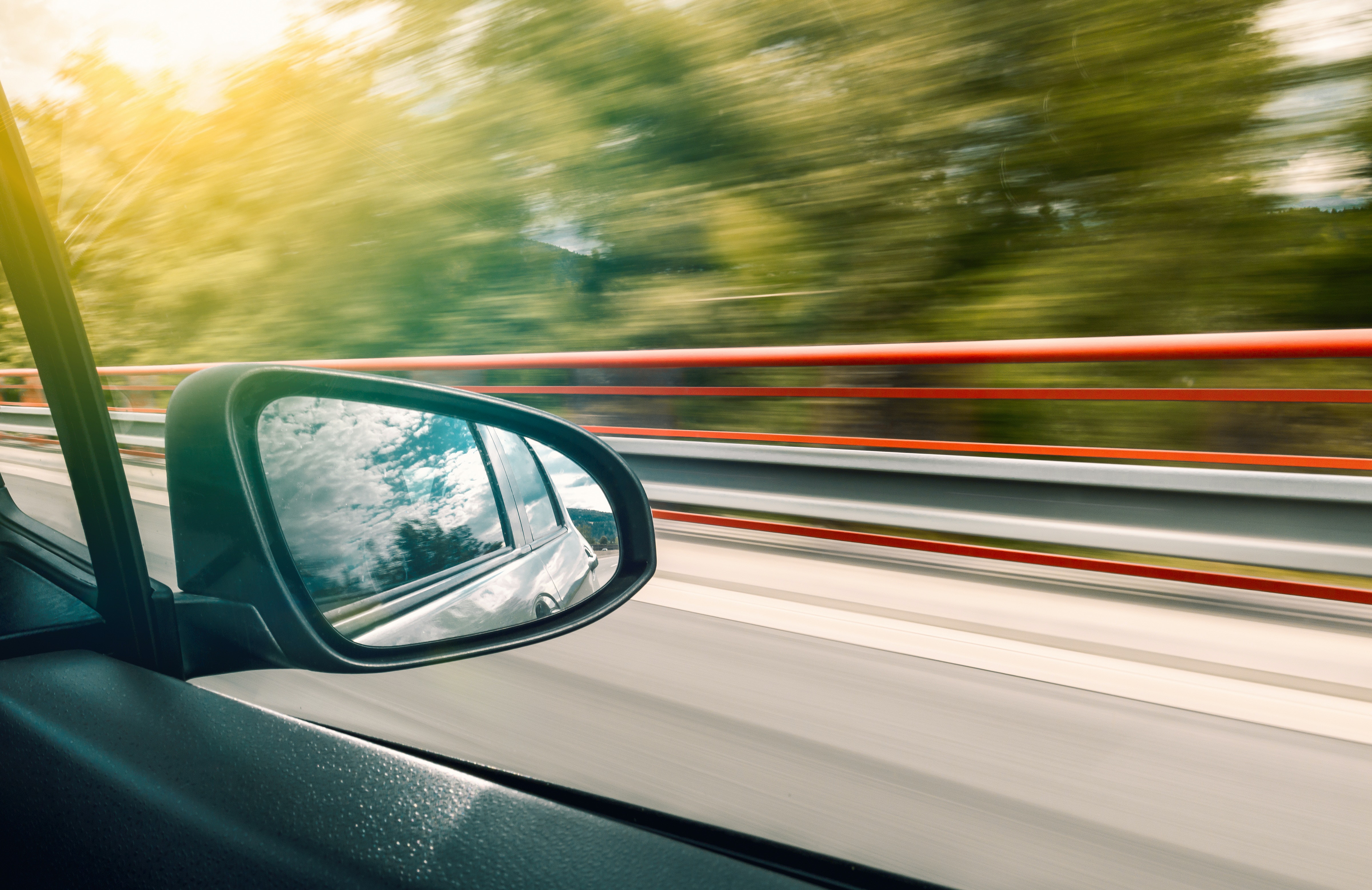 A side view mirror on a car.