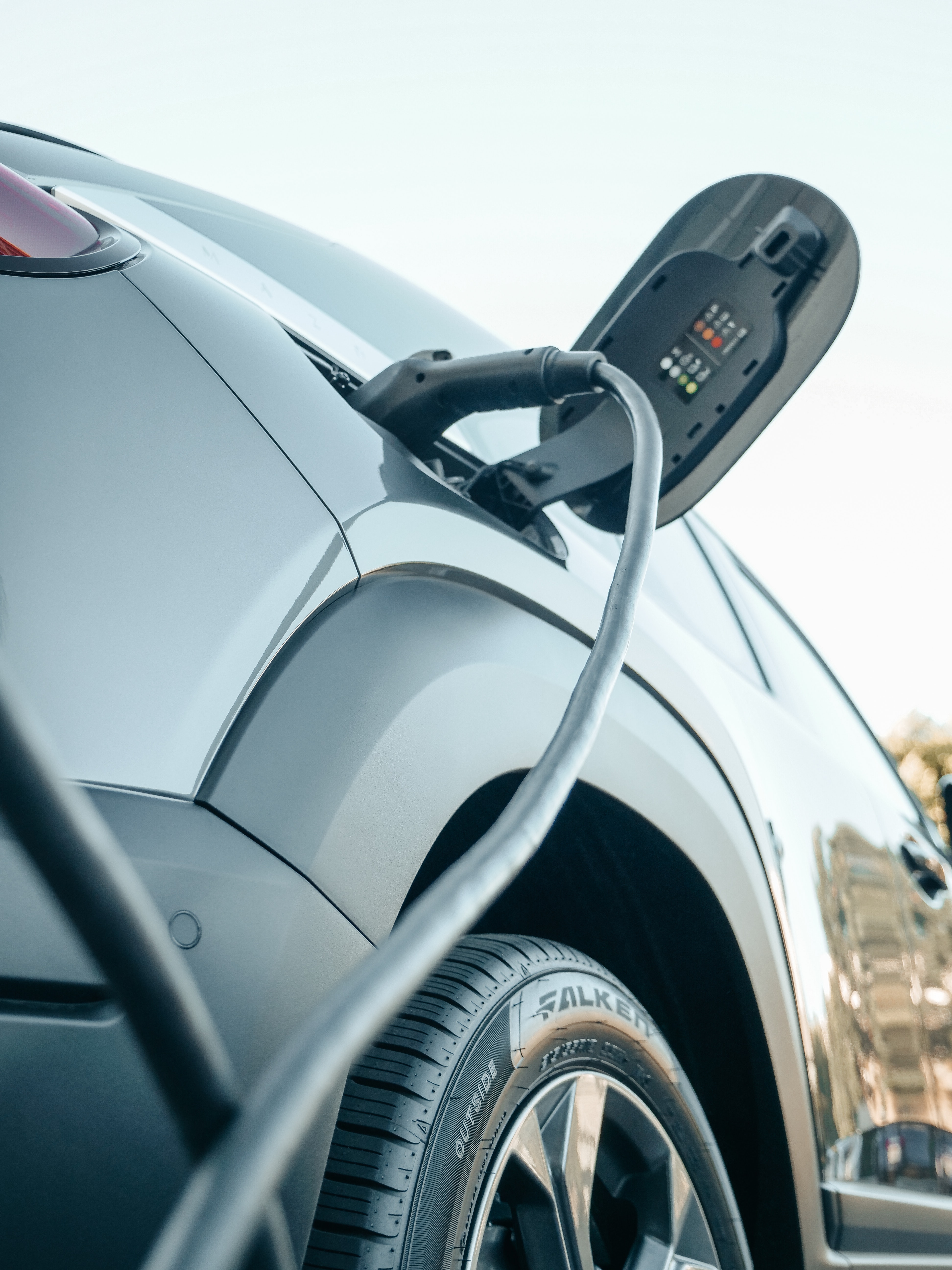 A person charging their car.