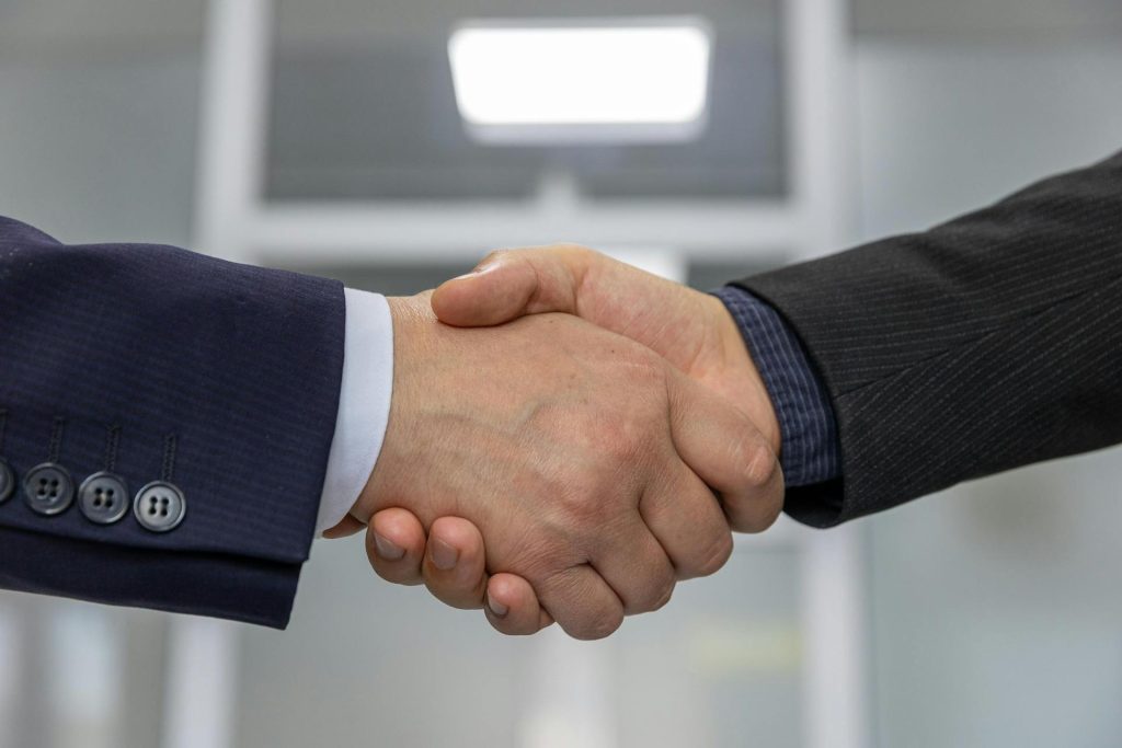 Two people shaking hands.
